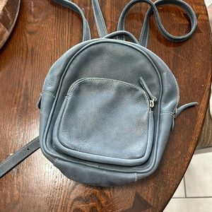 Roots purse/backpack leather blue/grey colour. Used once for a trip.